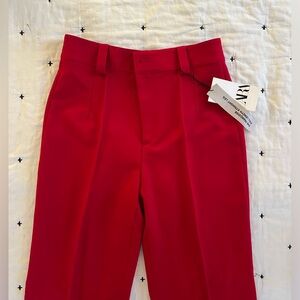 Full length straight leg red pants. New with tags